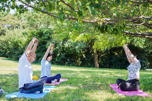istock Elderly person doing yoga in the open air 1307366016