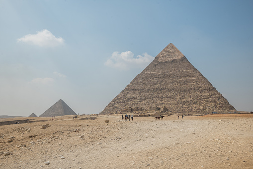 The Sphinx at Giza in Cairo set against the Pyramid  Pyramid of Khafre or of Chephren \n\nThe Great Sphinx is among the world’s largest sculptures, measuring some 240 feet (73 metres) long and 66 feet (20 metres) high. It features a lion’s body and a human head adorned with a royal headdress.