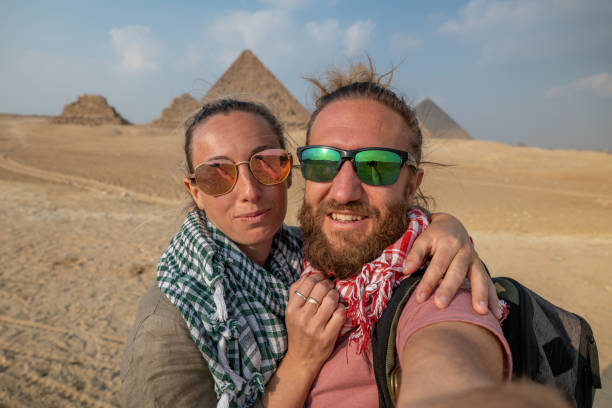 istock Happy couple take selfie at the pyramids, Egypt 1307368811