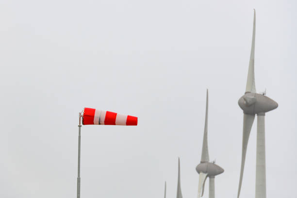 Wind sock in front of wind turbines in a storm at the shore of the IJsselmeer in the Noordoostpolder, Flevoland, The Netherlands.