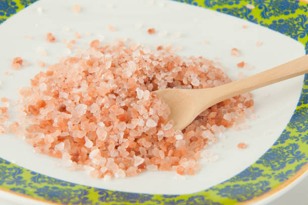 istock Pink salt from the Himalayas; photo on white background. 1307373896
