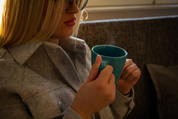 istock Young woman drink tea in cold winter days 1307375794