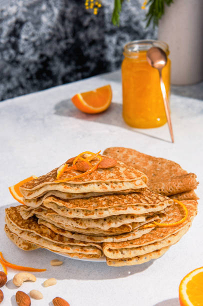 istock Crepes or Blinis folded with nuts and orange jam. 1307377077