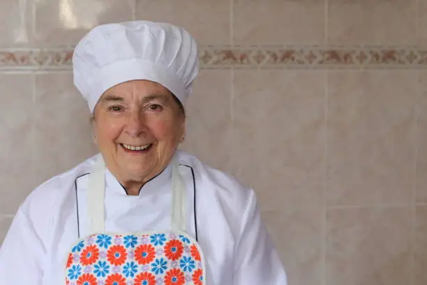 Photo of Senior chef with traditional outfit