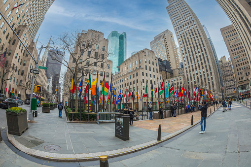 New York: Large angle view of Rockefeller Plaza. Rockefeller Center is a large complex consisting of 19 commercial buildings in the center of Midtown Manhattan.