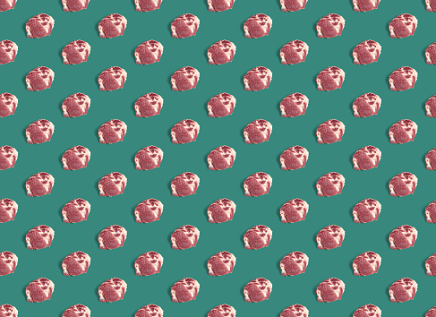 Seamless Pattern with raw pork meat slices on green background. Fresh raw pork meat Slices Loin, food pattern