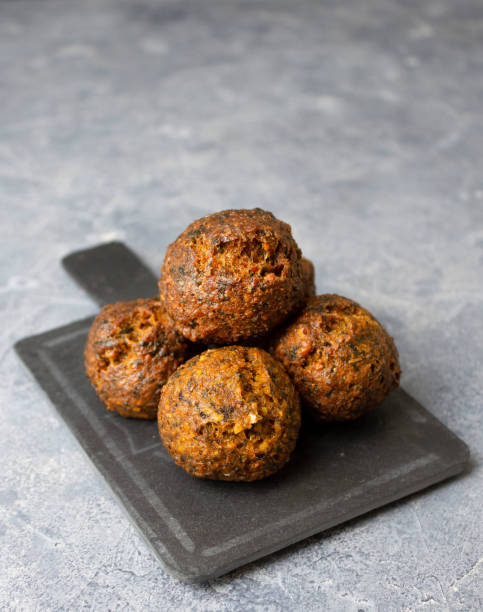 istock Fried falafel on a black slate board for snacks. Traditional oriental snack