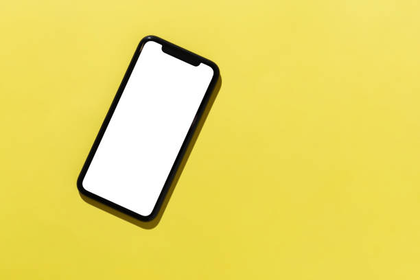 istock Modern smartphone template on a yellow background, top view 1307385003