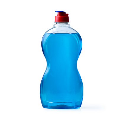Bottle with blue dishwashing detergent against a white background (with clipping path)