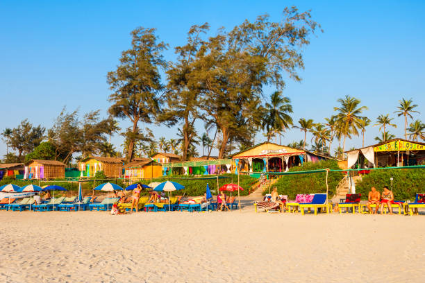 Beach in Goa, India GOA, INDIA - DECEMBER 09, 2016: Beach restaurant shacks and sunbeds on Arambol beach in north Goa, India palolem beach stock pictures, royalty-free photos & images