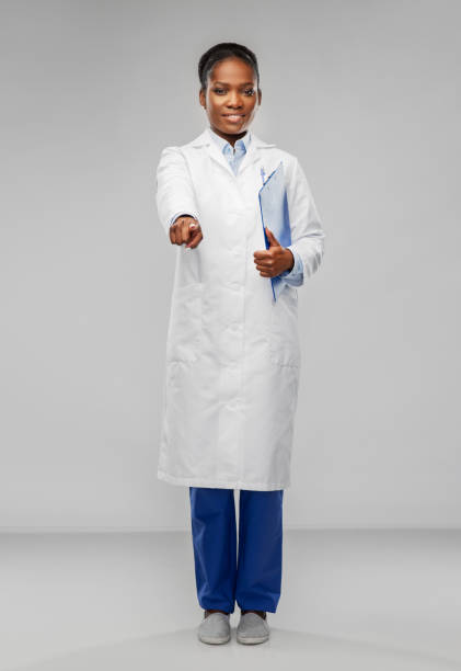 istock african female doctor pointing finger to camera 1307388050
