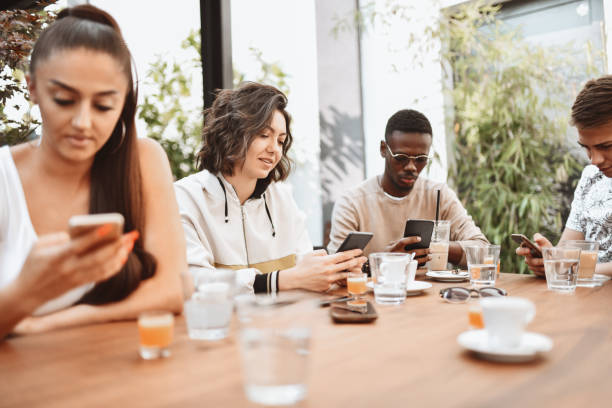 istock Antisocial Multiethnic Young People Focused On Smartphones Instead Of Communicating 1307392630