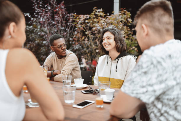 istock Modern Multiethnic Friends Spending Time Enjoying Coffee And Refreshments Together 1307392732