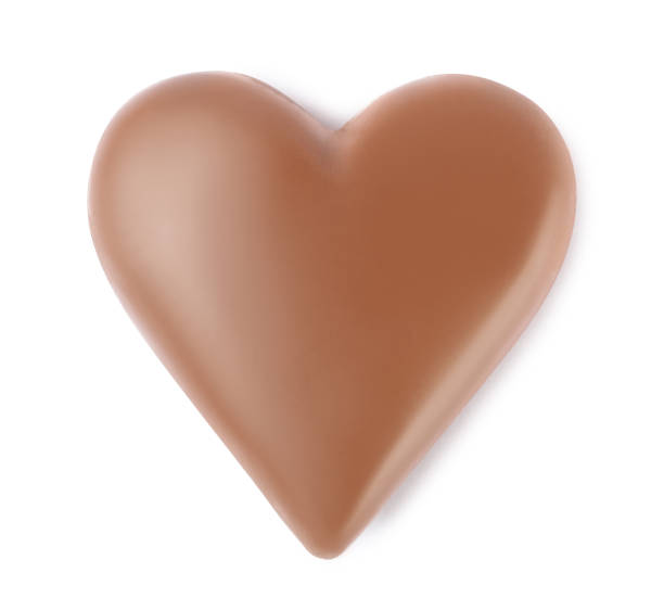 istock Beautiful heart shaped chocolate candy isolated on white, top view 1307393615