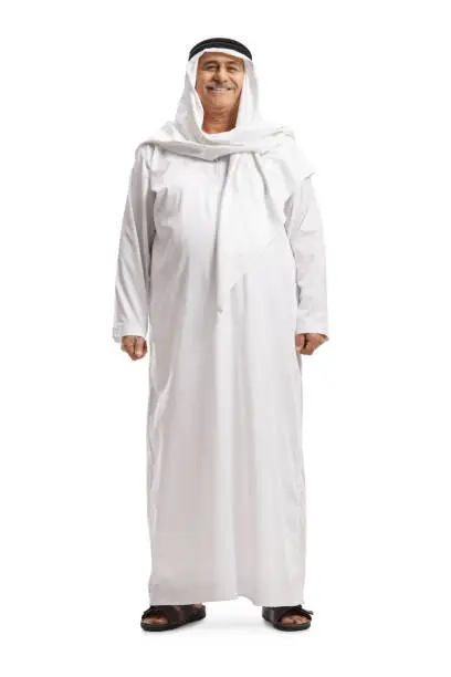 Full length portrait of a mature arab man in a traditional dishdasha isolated on white background