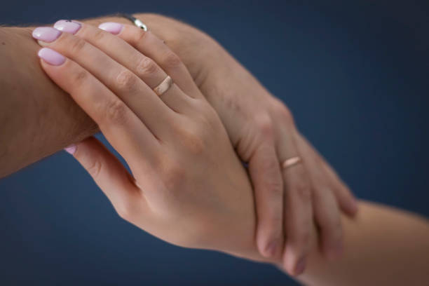 istock A loving couple holding hands. 1307395641