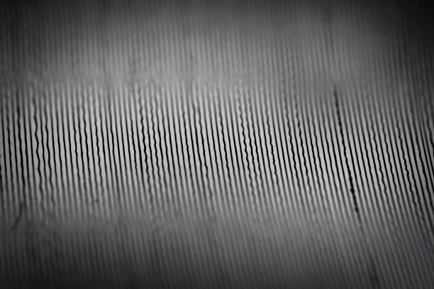 Macro shot of vinyl record Macro shot of black vinyl record. Surface of an old vinyl record. Shallow deph of field. grooved stock pictures, royalty-free photos & images