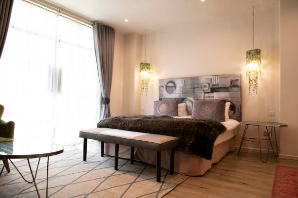 istock Cozy double bed in classy hotel room 1307396812