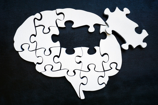 Brain from puzzle pieces with one missing. Memory problems and Alzheimer disease.