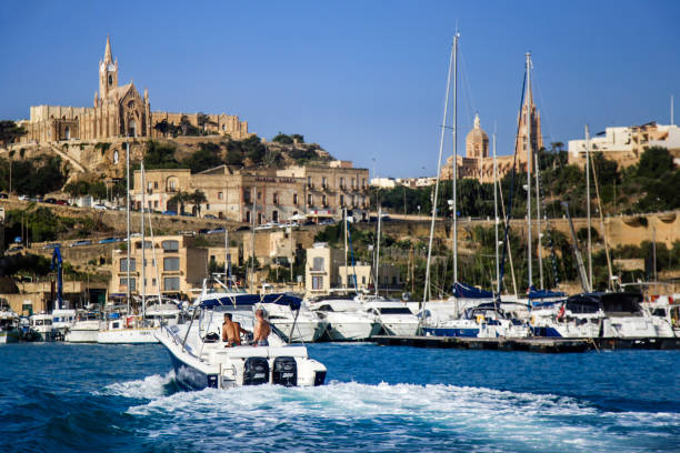 Spedboat in Mgarr marina Spedboat in Mgarr harbour on Gozo island on Malta. mgarr malta island gozo cityscape with harbor stock pictures, royalty-free photos & images