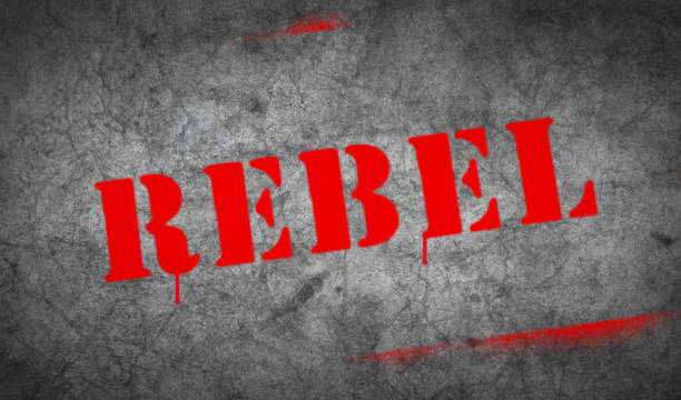 istock Rebel spray painted inscription on the concrete wall 1307398597