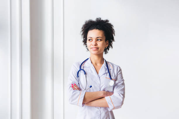 istock Doctor with stethoscope around his neck 1307400175
