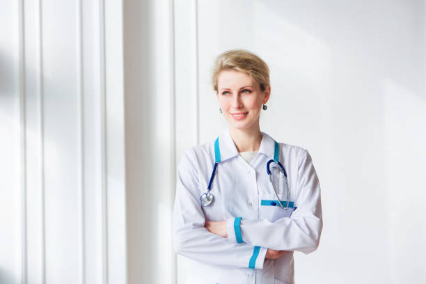 istock Doctor with stethoscope around his neck 1307400239