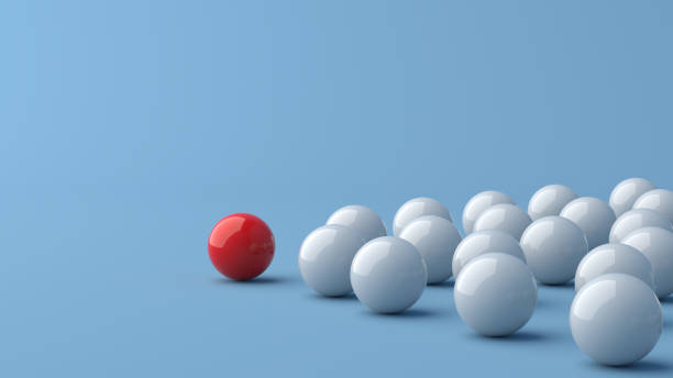 istock Leadership concept, red leader ball leading white balls, on blue background with empty copy space 1307400365