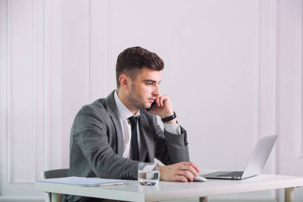 istock Businessman is talking by phone in a office 1307401001