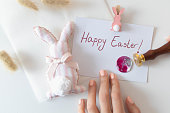Handmade happy easter card with sealing wax in the process