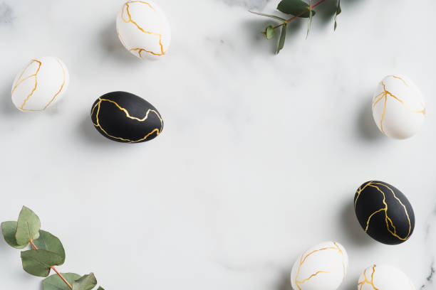 istock Happy Easter concept. Easter eggs decorated gold and eucalyptus on marble table. Flat lay, top view, copy space. 1307402628
