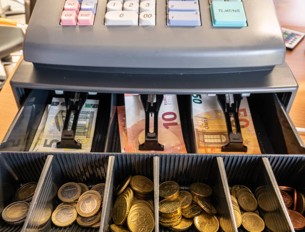 istock Cash register with change in store 1307405034