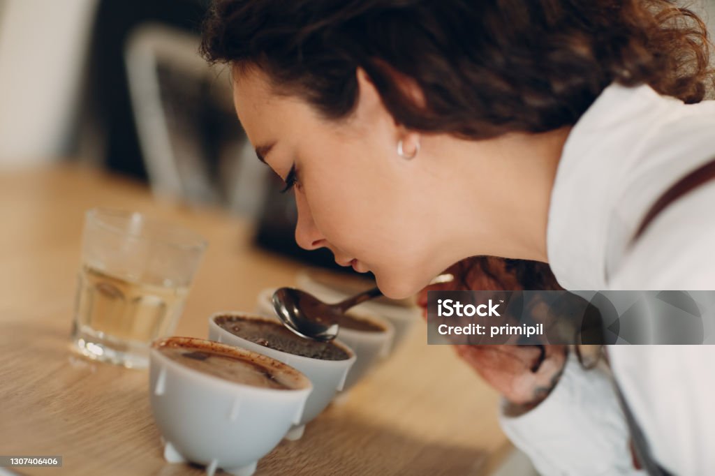 Cup Taster Girl Tasting Degustation Coffee Quality Test. Coffee Cupping Cup Taster Girl Tasting Degustation Coffee Quality Test. Coffee Cupping. Coffee - Drink Stock Photo