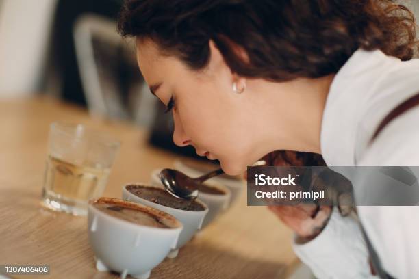 Cup Taster Girl Tasting Degustation Coffee Quality Test Coffee Cupping Stock Photo - Download Image Now