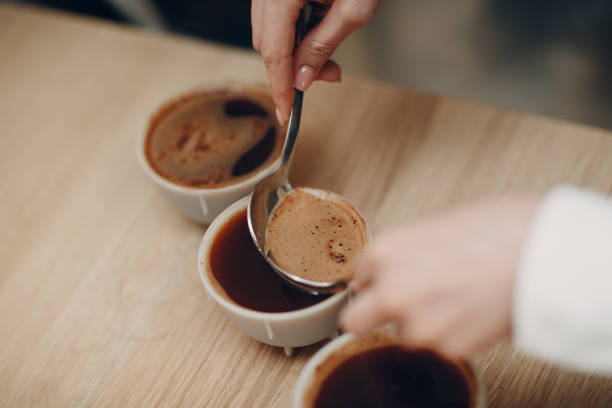 istock Cup Taster Girl Tasting Degustation Coffee Quality Test. Coffee Cupping 1307406418