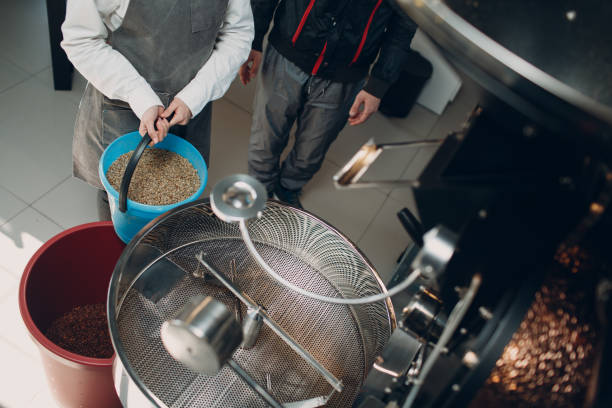 istock Coffee roaster machine at coffee roasting green and brown coffee beans process 1307406424