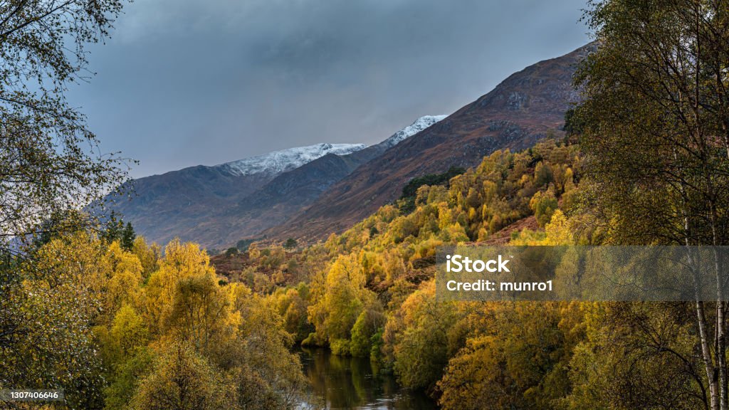 Autumn in Glen Affric The autumn colours in Glen Affric in the Scottish Highlands with the first snows on the hills Glen Affric Stock Photo