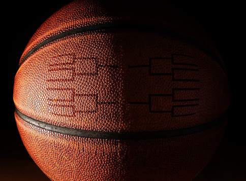 Closeup of a basketball with a tournament bracket design