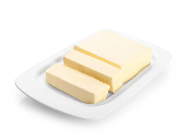 bloco de manteiga fresco isolado no fundo branco. - butter dairy product butter dish milk - fotografias e filmes do acervo