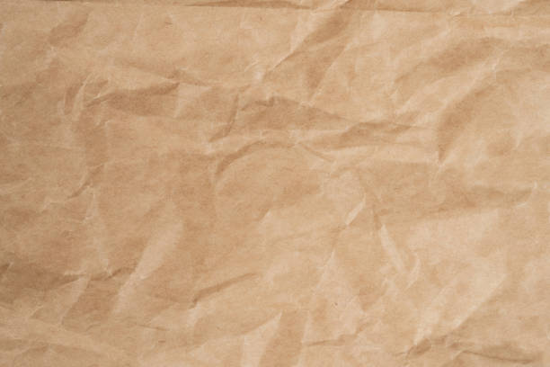 istock Close up crumpled brown paper texture and background with copy space 1307407652
