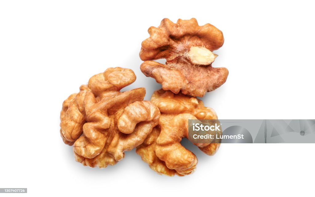 Golden nutritious walnut kernels isolated on white Walnut kernels isolated on white background. Top view. Walnut Stock Photo