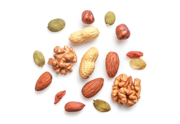 istock Mix of dry nuts isolated on white 1307407758