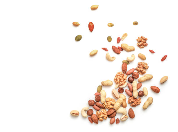 istock Mix of dry nuts isolated on white 1307407826