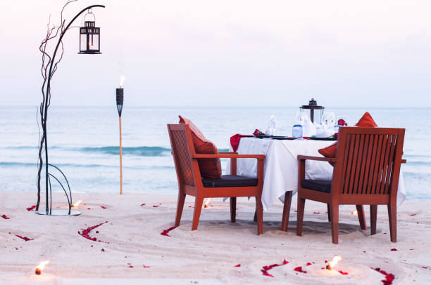 istock Honeymoon dinner table on island beach in Thailand 1307407903