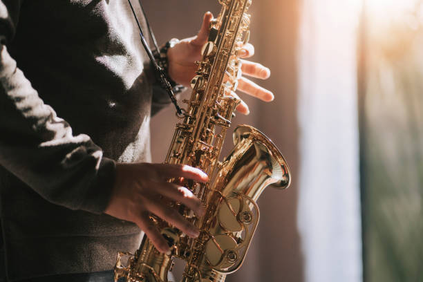 istock lifehack asian chinese mature man practicing saxophone at home during weekend leisure time 1307408065