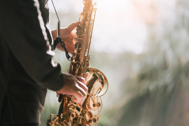 istock lifehack asian chinese mature man practicing saxophone at home during weekend leisure time 1307408070