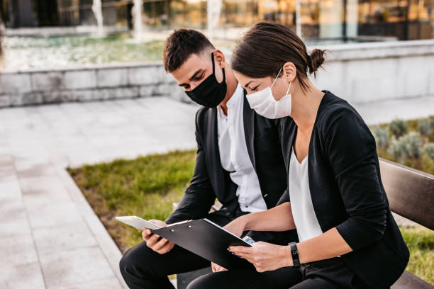 istock Business man and woman discussing work 1307408162