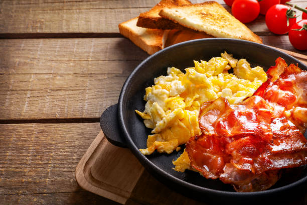 istock Traditional american breakfast with bacon and eggs 1307409104