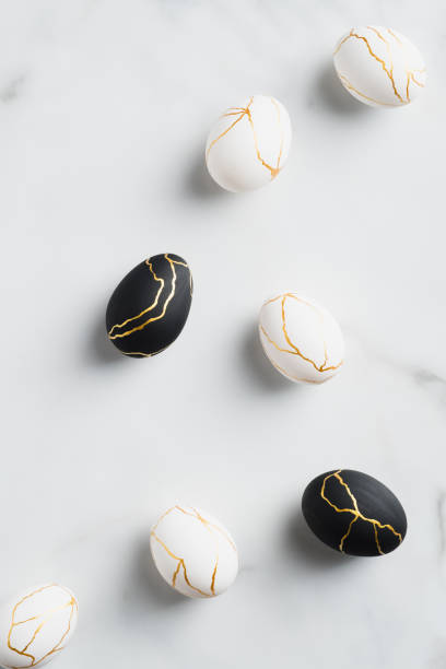 istock Luxury Easter eggs decorated gold on marble background. Flat lay, top view, vertical. Happy Easter concept. 1307409921