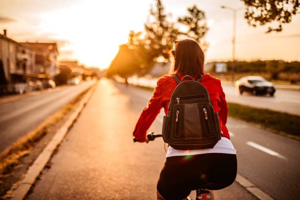 istock Young woman riding a bicycle 1307410655